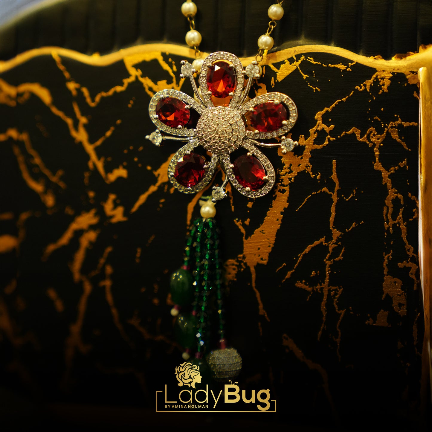 Emerald stone Mala with Red Broach