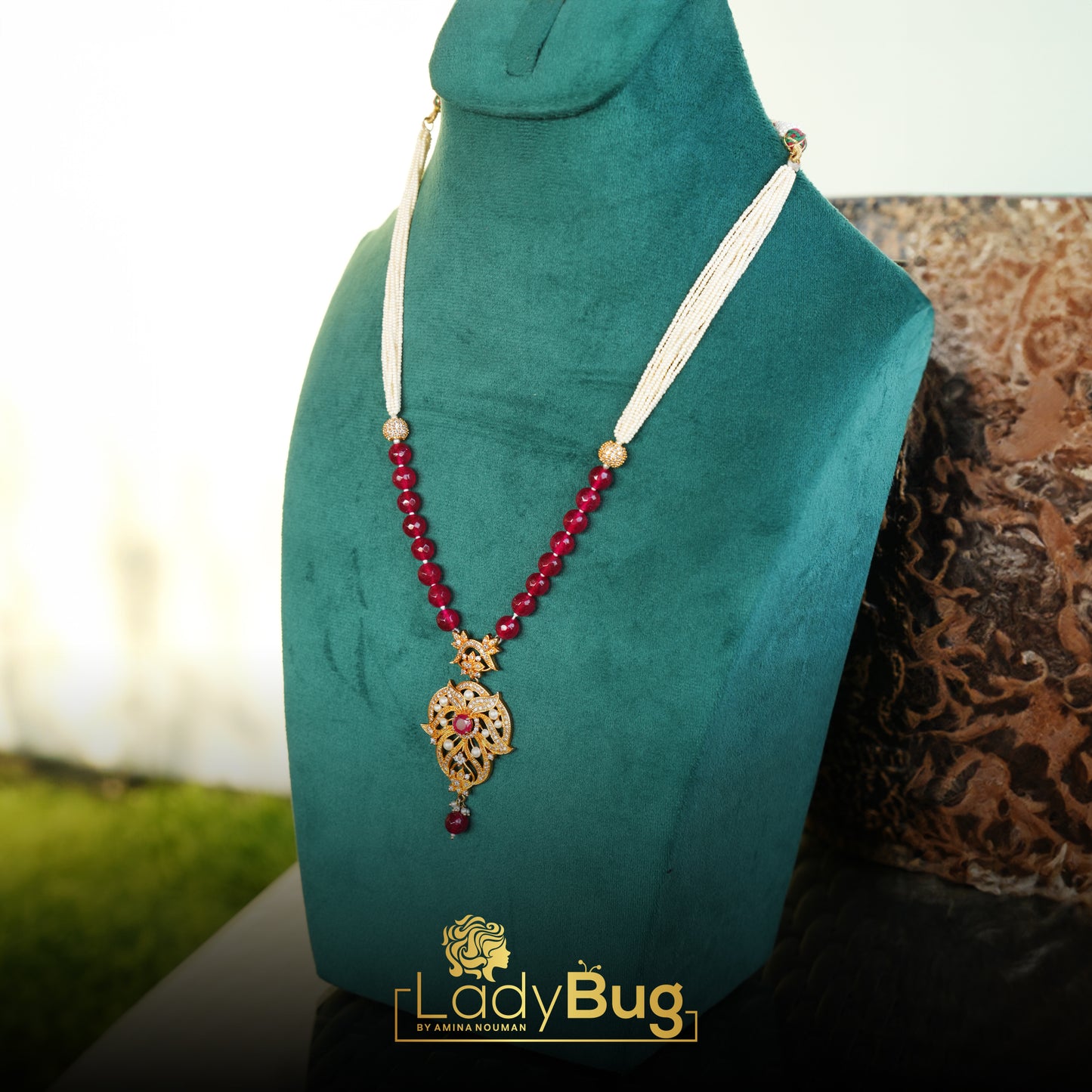 Gold-plated mala, with Ruby stones