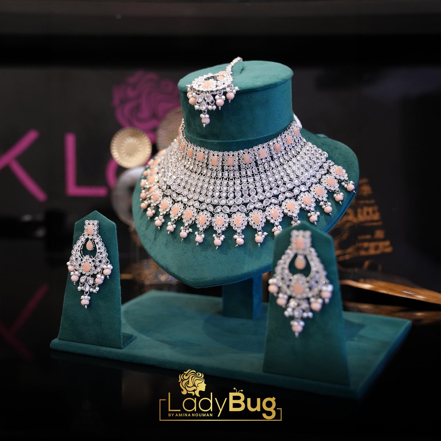 Rhodium-plated bridal set with white and peach color stone