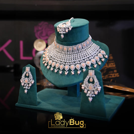 Rhodium-plated bridal set with white and peach color stone