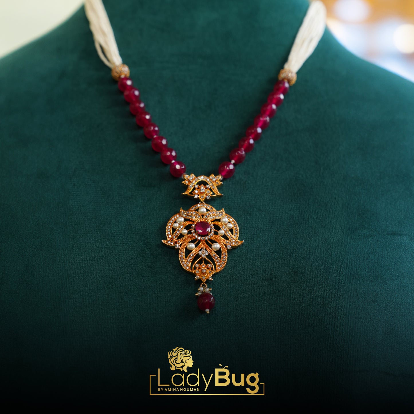 Gold-plated mala, with Ruby stones