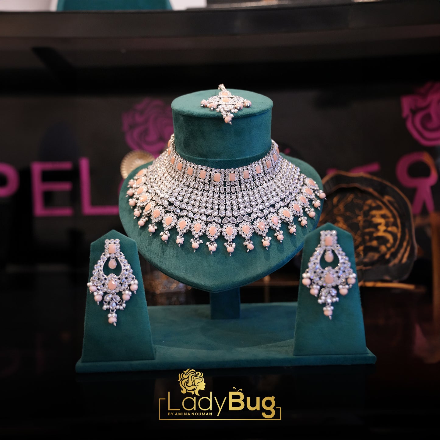 Rhodium-plated bridal set with white and peach color stone