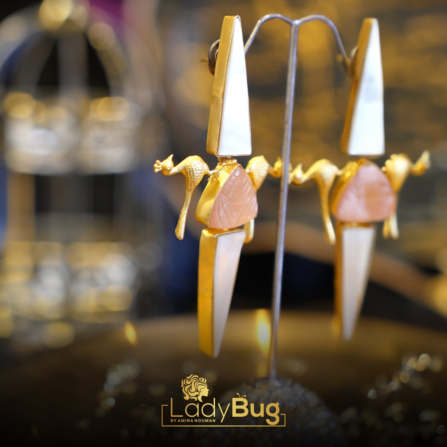 Long stone birdy earrings in champagne color