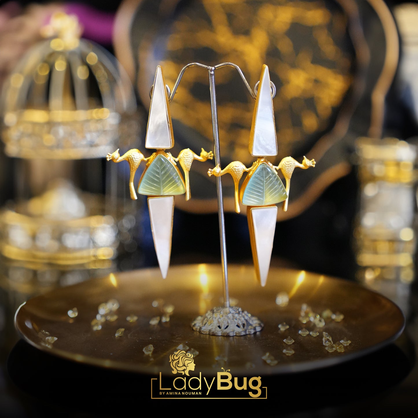 Long stone birdy earrings in mint color