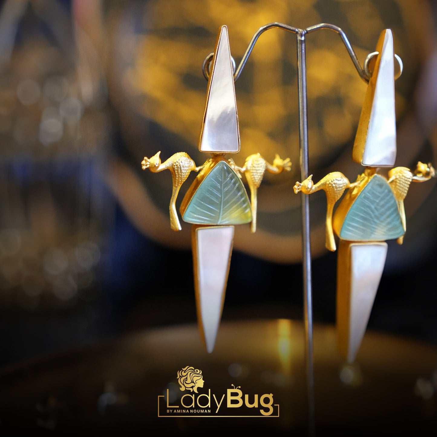 Long stone birdy earrings in mint color