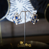 Rhodium-plated studs with sapphire stone and white pearls