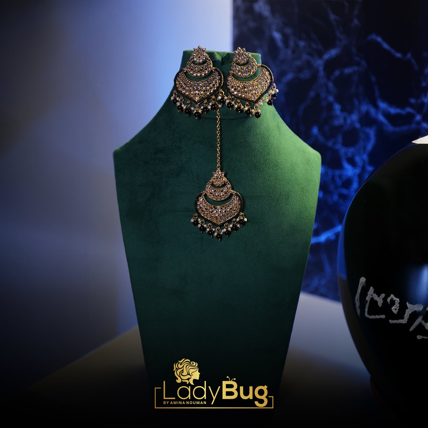 Big Kundan earrings with teeka in black color