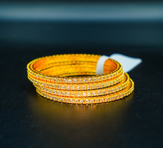 Gold-plated bangles with white stones