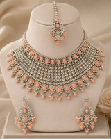 Rhodium-plated bridal set with white and peach color stone