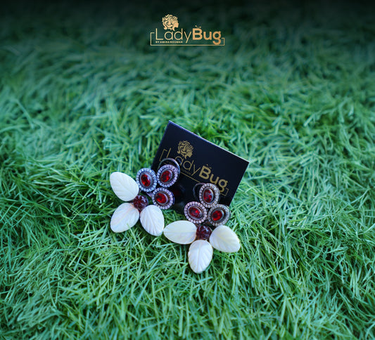 Studs with carved Mother Pearl & Ruby stones