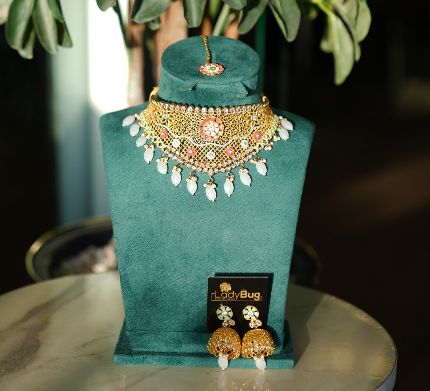 Gold-plated set with white stones and hand-paint